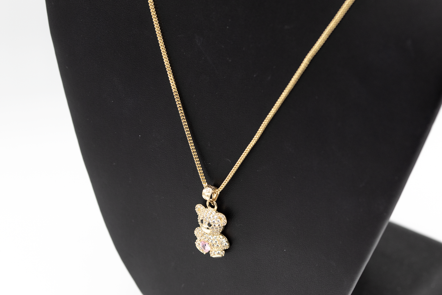 Charm pink bear design 10k gold and zirconia.